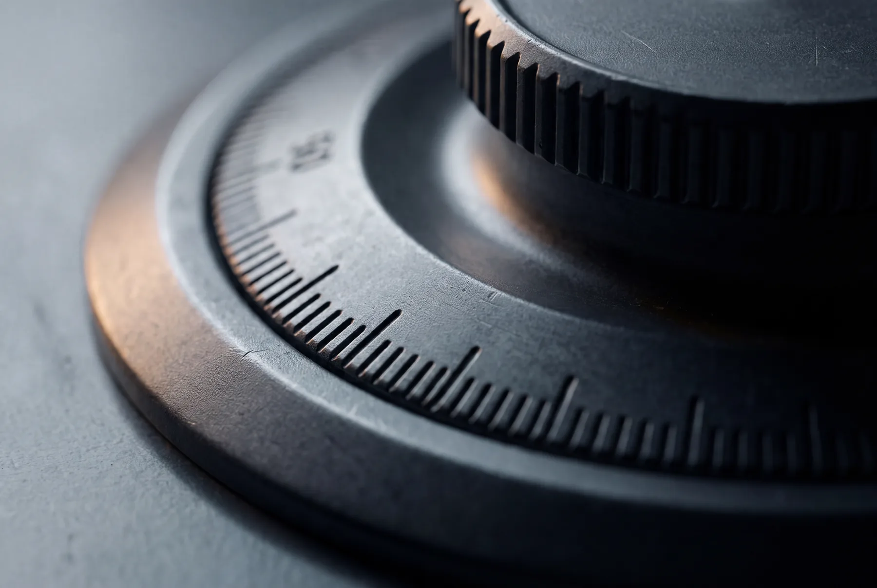 A precision-machined combination dial on brushed dark steel